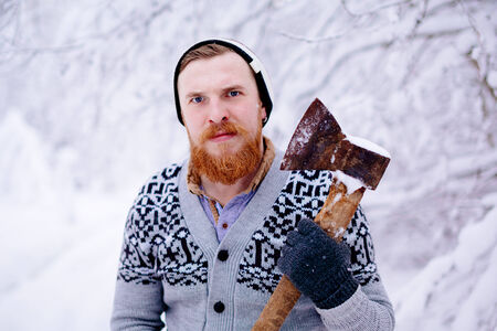 Lumberjack in the snowy winter forestの写真素材