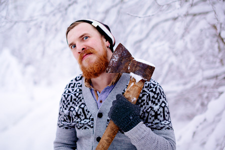 Lumberjack in the snowy winter forestの写真素材