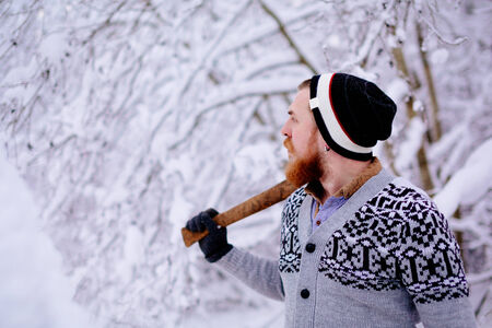 Lumberjack in the snowy winter forestの写真素材