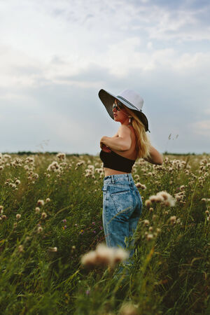 Beautiful girl in hat and sunglassesの写真素材
