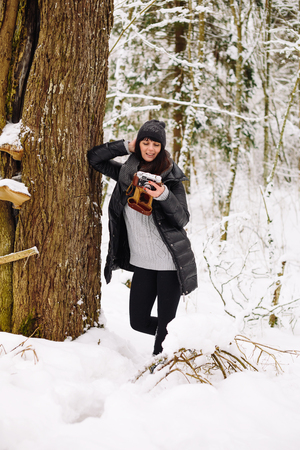 Girl in winter forestの写真素材