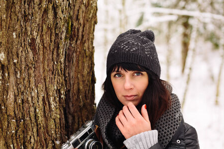 Girl in winter forestの写真素材