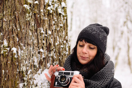 Girl in winter forestの写真素材