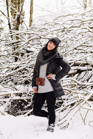 Girl in winter forestの写真素材