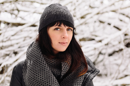 Girl in winter forestの写真素材