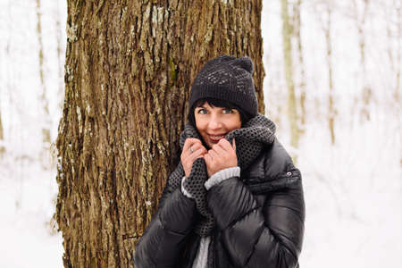 Girl in winter forestの写真素材