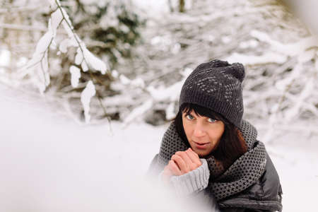 Girl in winter forestの写真素材