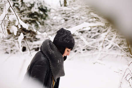 Girl in winter forestの写真素材