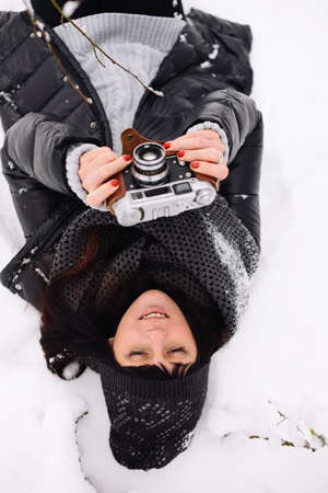 Girl in winter forestの写真素材
