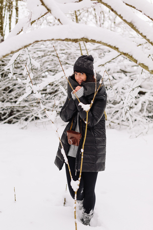Girl in winter forestの写真素材
