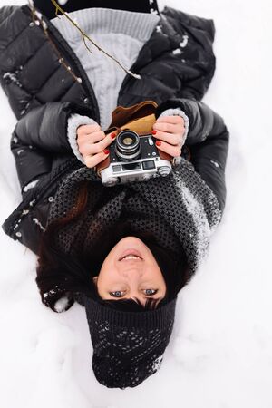Girl in winter forestの写真素材