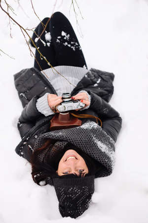 Girl in winter forestの写真素材