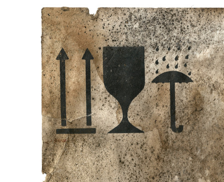 Sign of a package on the old vintage cardboard. Closeup sign on cardboard containerの写真素材