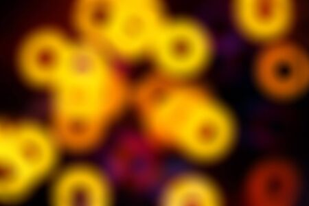 Blurred abstract background with colored rings on a dark backdrop.