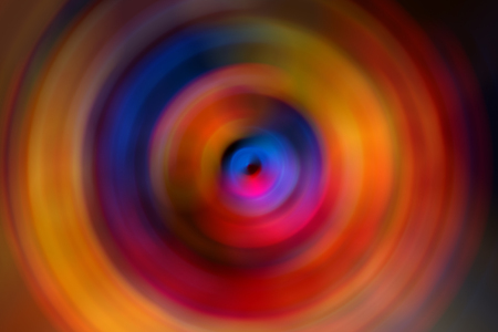 Abstract background of colorful spin radial motion blurの写真素材