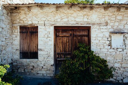 old door and window of brick buildingの写真素材