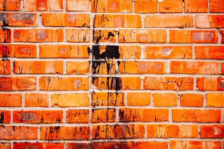 red brick wall close up In the middle of the black spotの写真素材
