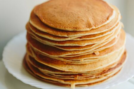 Russian pancakes close-up on a white background. color photoの写真素材