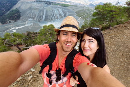 Beautiful young couple fun on selfie. Troodos Mountains in Cyprusの写真素材