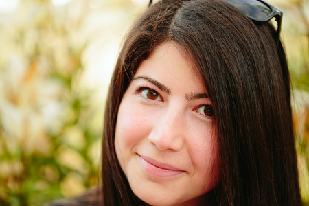 Closeup photo of a beautiful girl with black hair.の写真素材