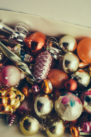 Closeup view of many beautiful christmas or new year fir tree decoration colorful toys in box.の写真素材