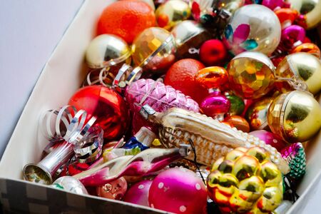Closeup view of many beautiful christmas or new year fir tree decoration colorful toys in box.の写真素材