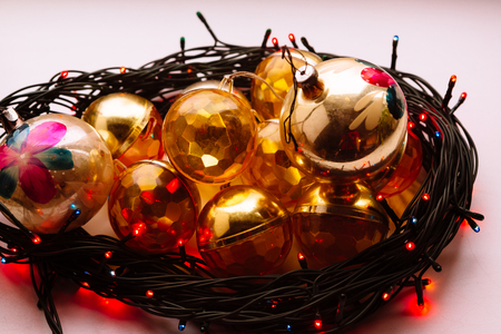 Christmas or new year fir tree decoration toys in a circle christmas lamp garland.の写真素材