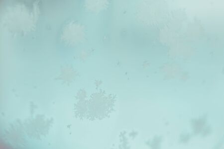 Abstract background blue krayola color with snowflakes. Colorful photo.