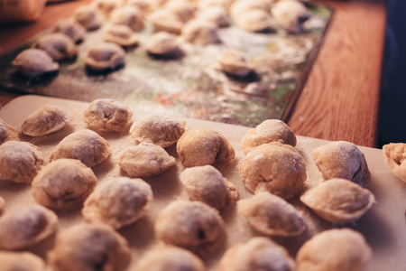Raw Meat dumplings Russian traditional pelmeni with meat. Close up photo.の写真素材