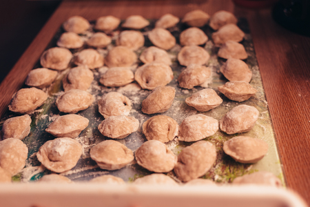 Raw Meat dumplings Russian traditional pelmeni with meat. Close up photo.の写真素材