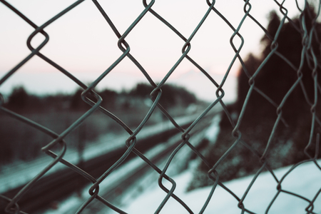 Metal grid on the background of the rails. Close up photo.の写真素材