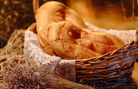 Several Armenian homemade mantakash bread in a basket. Colorful photo.