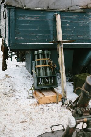 Green bombs in a metal box near the truck.の写真素材