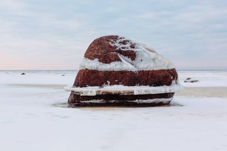 Big stone in winter time against the sky and the gulf.の写真素材