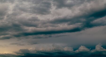 Dark storm sky and gray clouds. Dark background.の写真素材