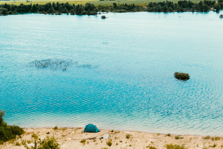 Beautiful landscape of blue lake and trees. Outdoors photo.の写真素材
