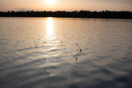 Water and bobber at evening. Holidays photo.の写真素材