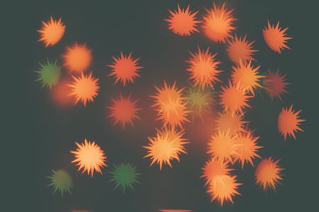 Many orange snowflakes on a dark background. Design wallpaper.の写真素材