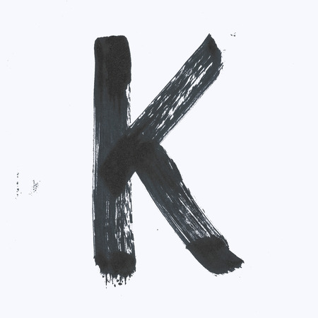 Capital black letter K on a white background.の写真素材