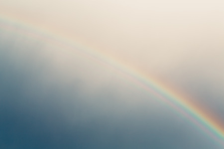 Blue sky and rainbow photo at evening.の写真素材