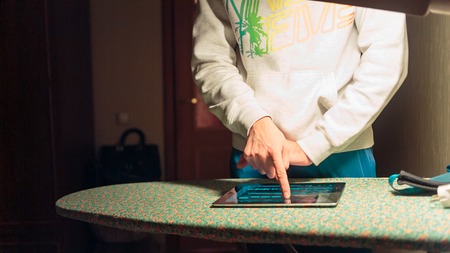 Young man listening to your favorite music on the computer tablet