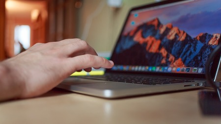 man working at a laptop closeup. hands closeupの写真素材