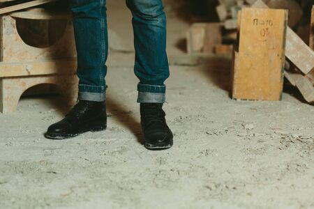 Black leather mens shoes stylish and classic jeans close-upの写真素材
