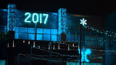 Christmas illumination on a building facade at nightの写真素材