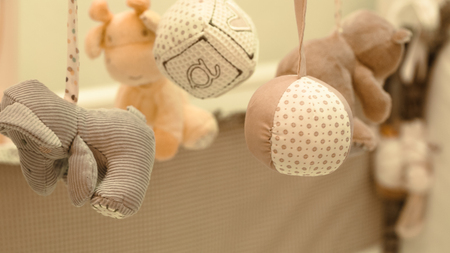Childrens mobility hanging toy in the crib close-upの写真素材
