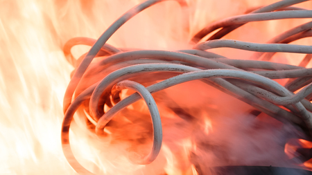 wires on fire. Firing winding insulation of electrical wiring in the fire close-up