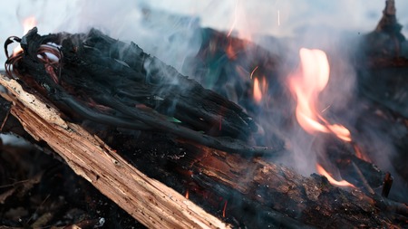 wires on fire. Firing winding insulation of electrical wiring in the fire in the winter woods