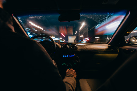 Riding through the city by car. view from the passenger compartmentの写真素材