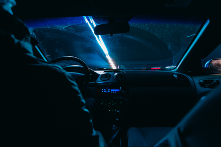 Riding through the city by car. view from the passenger compartment