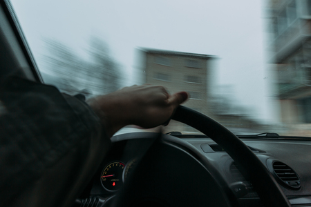 Riding behind the wheel of a car in winter. first-person view